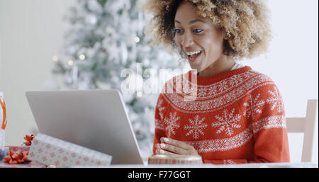 Excited happy young woman at Christmas Stock Photo