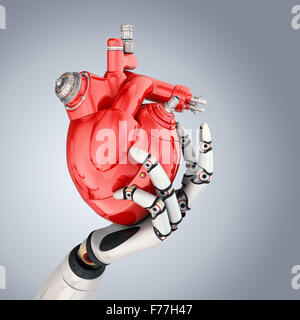Mechanical heart in robots hand. Clipping path included Stock Photo