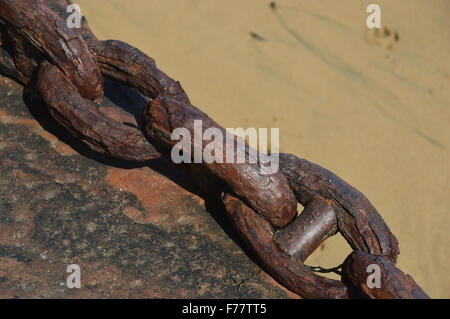 Rusty Old Mooring Chain Exposed by the Tide in Bonne Nuit Bay, Jersey Channel Islands. Stock Photo