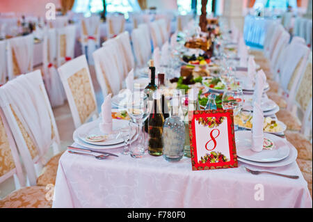 Plate on wedding table number eight Stock Photo
