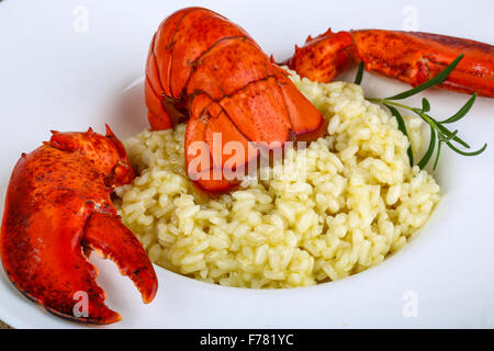 Delicous Risotto with lobster served rosemary and parmesan Stock Photo ...