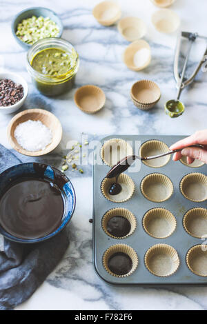 Salted chocolate pistachio butter cups ingredients. Stock Photo