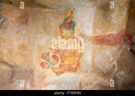 Sri Lanka - Sigiriya, ancient frescoes, cave wall paintings inside Sigiriya fortress, UNESCO World Heritage Site Stock Photo