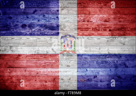 A vignetted background image of the flag of Dominican Republic painted onto wooden boards of a wall or floor. Stock Photo