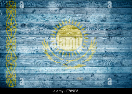 A vignetted background image of the flag of Kazakhstan painted onto wooden boards of a wall or floor. Stock Photo