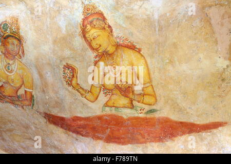 Sri Lanka - Sigiriya, ancient frescoes at cave wall inside Sigiriya fortress, UNESCO World Heritage Site Stock Photo