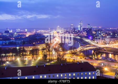 Aerial view of the illuminated cityscape of Vilnius at night with ...