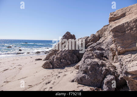 Rock formations at Leo Carrillo Beach State Park in Malibu California during the summer at low tide. Stock Photo