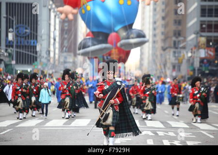 New York City, United States. 26th Nov, 2015. Tartan-clad drum major NYPD marching band. The 89th annual Macy's Thanksgiving Day parade attracted hundreds of thousands of spectators in spite of threats of possible terrorist action. Credit:  Andy Katz/Pacific Press/Alamy Live News Stock Photo