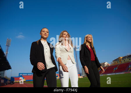 business people running together on racing track Stock Photo