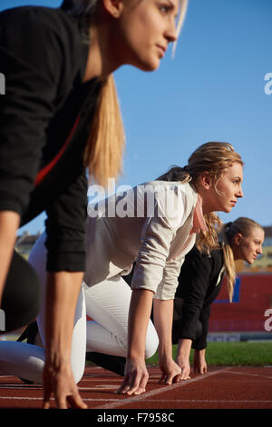 business people running together on racing track Stock Photo