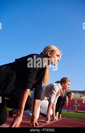 business people running together on racing track Stock Photo