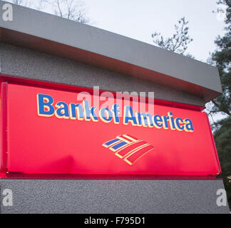 Seattle, Washingtion, USA. 23rd Nov, 2015. A Bank of America ATM with small roof, lights and security camera, located at Seattle Center, provides clients easy access to banking information and cash using a debit and or credit card. The BOFA atm is easily identified with letters printing out ''Bank of America, '' along with a small stylized design meant to represent the American flag in red, white and blue. © David Bro/ZUMA Wire/Alamy Live News Stock Photo