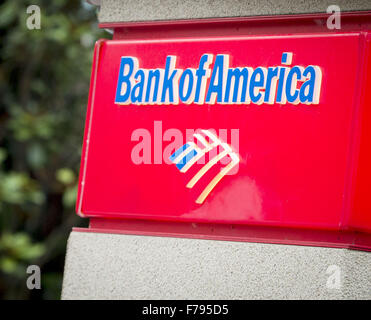 Seattle, Washingtion, USA. 23rd Nov, 2015. A Bank of America ATM with small roof, lights and security camera, located at Seattle Center, provides clients easy access to banking information and cash using a debit and or credit card. The BOFA atm is easily identified with letters printing out ''Bank of America, '' along with a small stylized design meant to represent the American flag in red, white and blue. © David Bro/ZUMA Wire/Alamy Live News Stock Photo