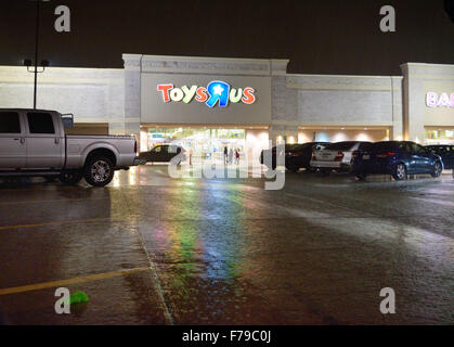 Shoppers at this Toys r Us store ventured out in the rain in order to load up on Christmas gifts on Thanksgiving night Stock Photo