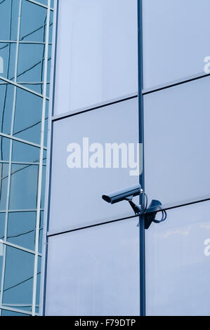 Outdoor surveillance camera on the wall of modern building Stock Photo