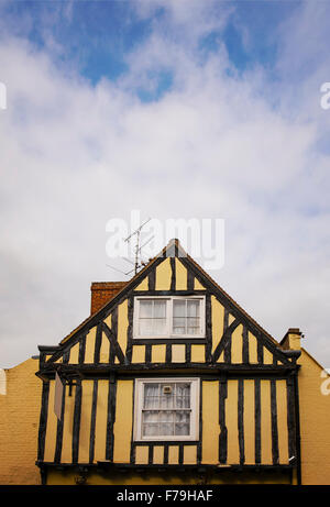 Image of the gable of a yellow half timbered house. Canterbury, England.