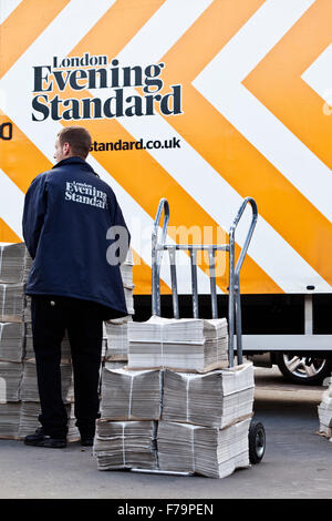 Copies of the London Evening Standard being unloaded for sale. Stock Photo