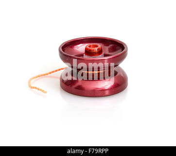 Red yoyo with twine on the white background. Toy theme. Stock Photo