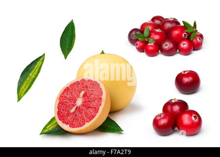 Set of cranberries, whole and sliced pink grapefruit isolated on white. Exploded view. Large depth of field Stock Photo