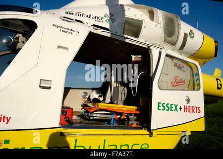 Essex and Herts air ambulance trust helicopter at bathhouse meadow Walton on the Naze Stock Photo