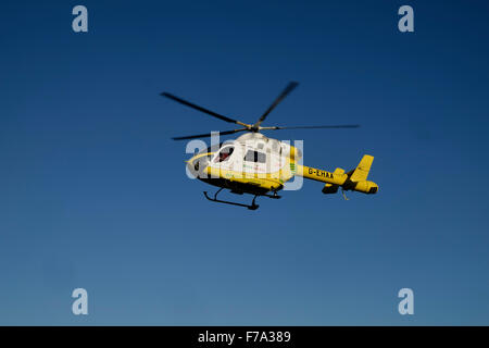 Essex and Herts air ambulance trust helicopter at bathhouse meadow Walton on the Naze with a roead ambulance Stock Photo