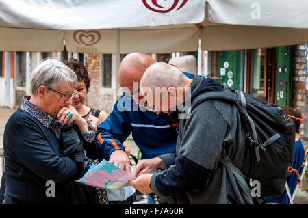 Tourist looking at a map in Venice, Italy Stock Photo
