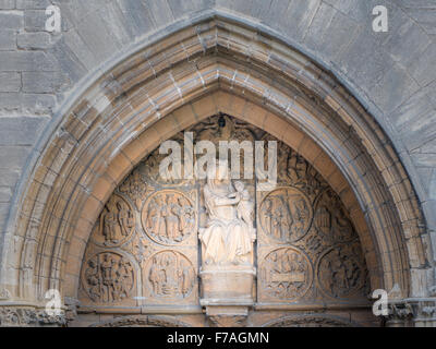 Sculpture of Mary and Jesus above the west door to the medieval church of St Mary the Virgin, dating from the thirteenth century Stock Photo