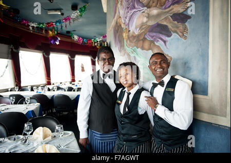 Waiters at the Roma Revolving Restaurant in Durban South Africa. Stock Photo