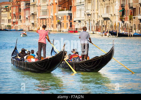 Grand Canal (Canal Grande) - two venetian gondola with tourists, Venice, Italy Stock Photo