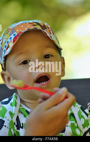 Happy boy eating - liitle boy Stock Photo