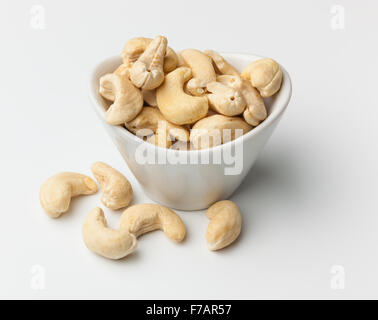 Cashew nuts in a white bowl isolated Stock Photo