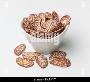 Betel nut chips in a bowl isolated on white Stock Photo
