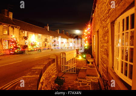 Christmas lights on the main street in Castleton village, Peak District National Park, Derbyshire,England, UK Stock Photo