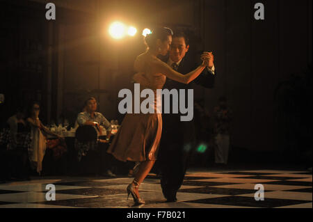 Bali, Indonesia. 27th Nov, 2015. Tango dancers Jino and Yuni Park from South Korea perform during the Tango in Paradise Festival 2015 at Denpasar in Bali, Indonesia, Nov. 27, 2015. Tango in Paradise Festival is an unique Tango festival that combines Tango with Indonesian traditional culture. This year, one of the traditional fabrics from Bali 'Saput Poleng Bali' (a cloth with checkered pattern of black and white) will be the icon of the festival. © Veri Sanovri/Xinhua/Alamy Live News Stock Photo
