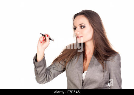 Business woman writing something with a marker on white background. Stock Photo