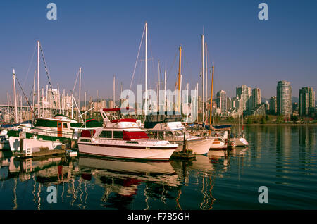 Vancouver, BC, British Columbia, Canada - Pleasure Boats docked at Marina in False Creek, City Skyline beyond Stock Photo