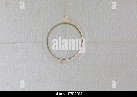 Building insulation - closeup of anchoring facade polystyrene. Stock Photo