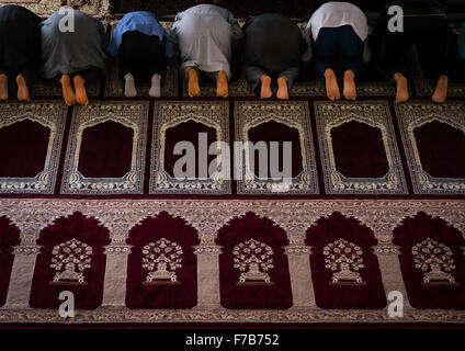 Iranian Shiite Muslim Men Kneeling And Praying In Mosque, Golestan Province, Karim Ishan, Iran Stock Photo