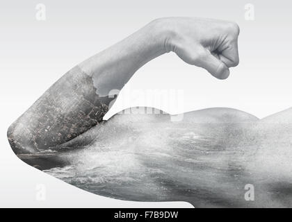 Strong male arm shows biceps combined with coastal sea landscape, double exposure photo effect, power of nature metaphor Stock Photo