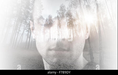 Young man, portrait with closed eyes combined with forest landscape, double exposure photo effect Stock Photo