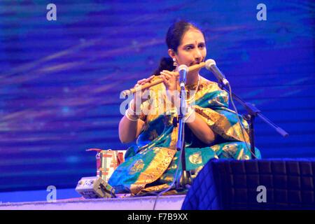 Dhaka, Bangladesh.  28th November, 2015. Indian artist Jayprada ramamurthy playing bamboo flute in the Bengal Classical Music Festival at Army Stadium in Dhaka, Bangladesh. On November 27, 2015 Five-day Bengal Classical Music Festival began at Army Stadium in Dhaka on Friday evening. Noted musicians and artistes of the sub-continent are taking part in the Bengal Classical Music Festival organized  By Bangal Foundation in Bangladesh. Credit:  Mamunur Rashid/Alamy Live News Stock Photo