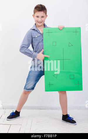 The boy holding a banner on white background Stock Photo