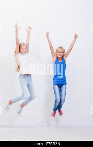 group of happy friends jumping high at park Stock Photo - Alamy