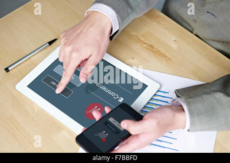 hands of a man using cellphone and tablet computer while shopping online. Stock Photo