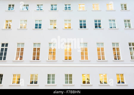 Multiple windows on a large office building. Stock Photo
