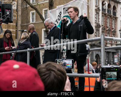 Westminster, London, UK. 28th November,2015. Own Jones addresses protesters at the stop the war demonstration outside Downing Street © Credit:  Oliver Lynton/Alamy Live News Stock Photo