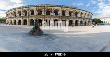 Roman Arena (Amphitheater) in Arles and bullfighter sculpture, Provence, France Stock Photo