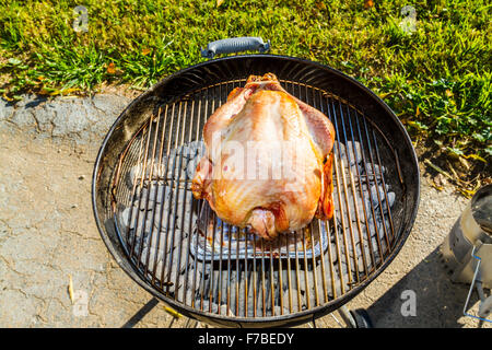 A salt rub brined Thanksgiving Turkey cooked on a Weber Kettle barbecue Stock Photo