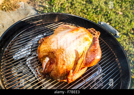 A salt rub brined Thanksgiving Turkey cooked on a Weber Kettle barbecue Stock Photo